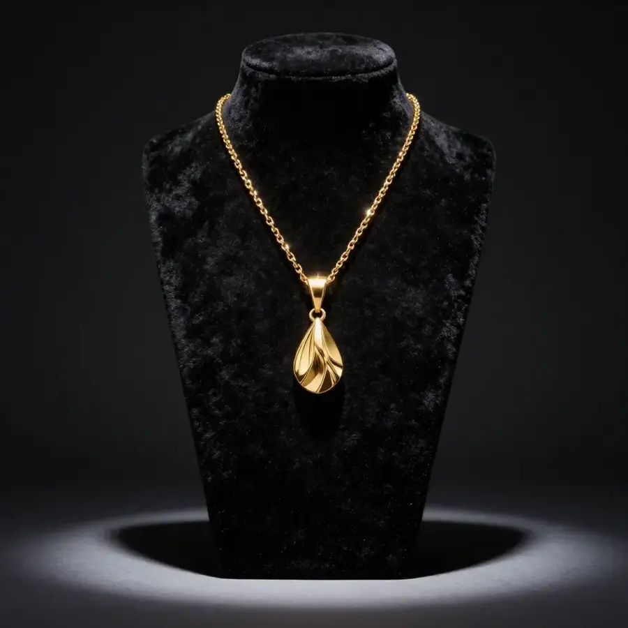 Gold pendant on velvet bust
