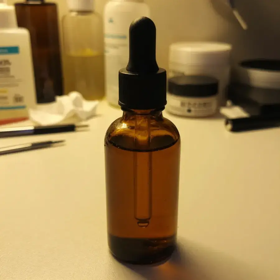 Phone photo of serum bottle on cluttered counter